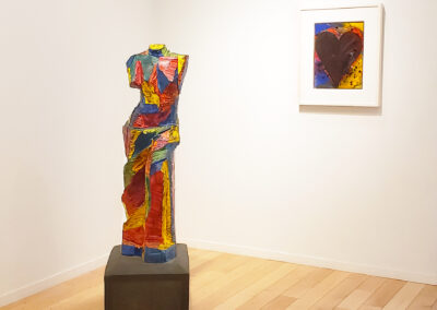 Install shot of colorful Venus de Milo sculpture and small heart painting by Jim Dine