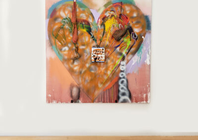 Installation close up of large, abstract heart painting with objects attached by Jim Dine